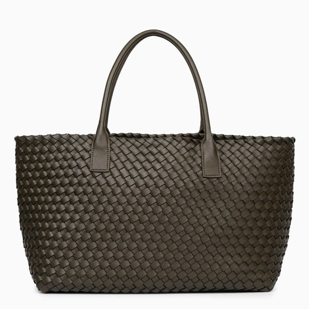 Woven handbag with leather handles on a white background