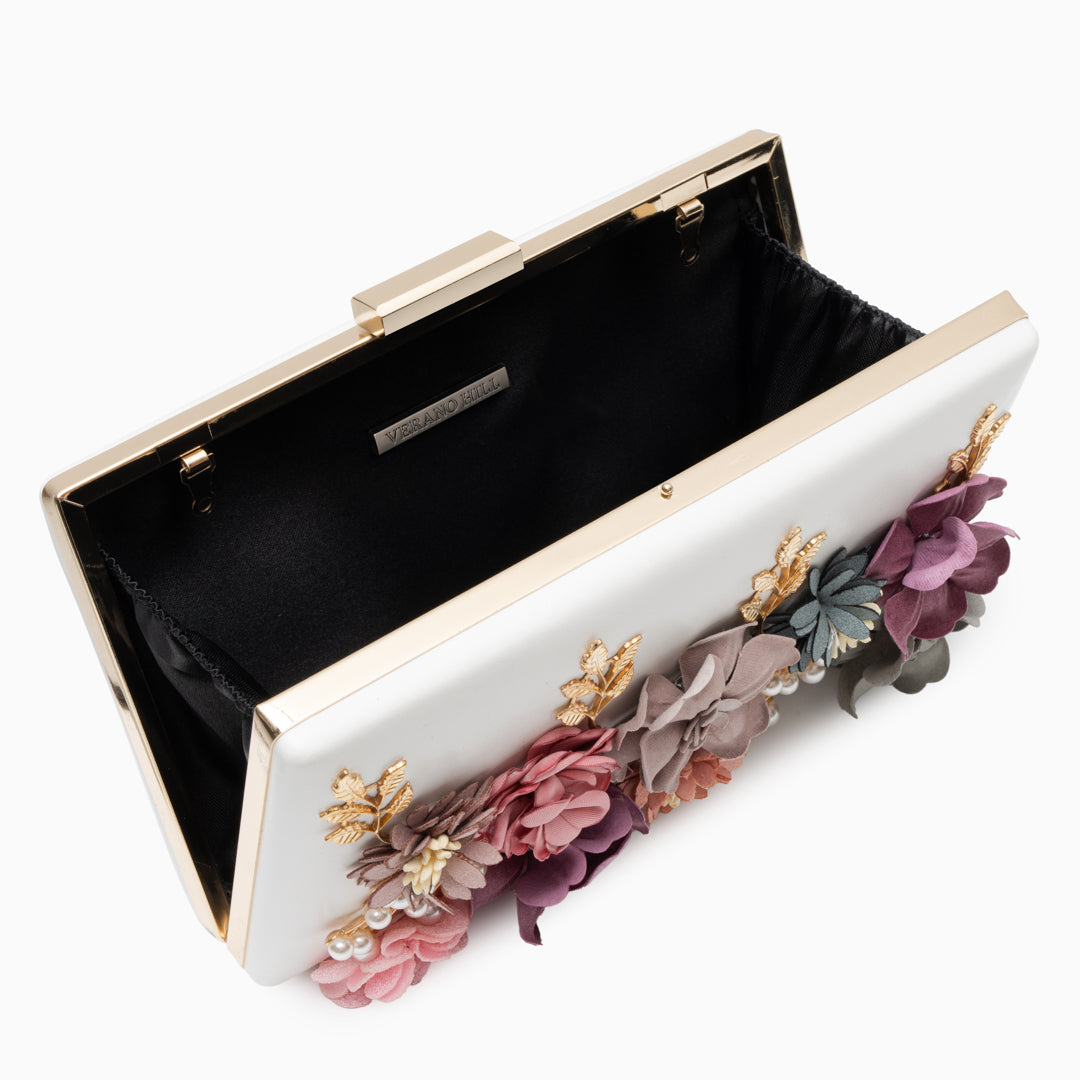 Chic rose clutch bag in white, red, pink, and beige, showcasing a stylish vegan-friendly design for evening occasions. 3