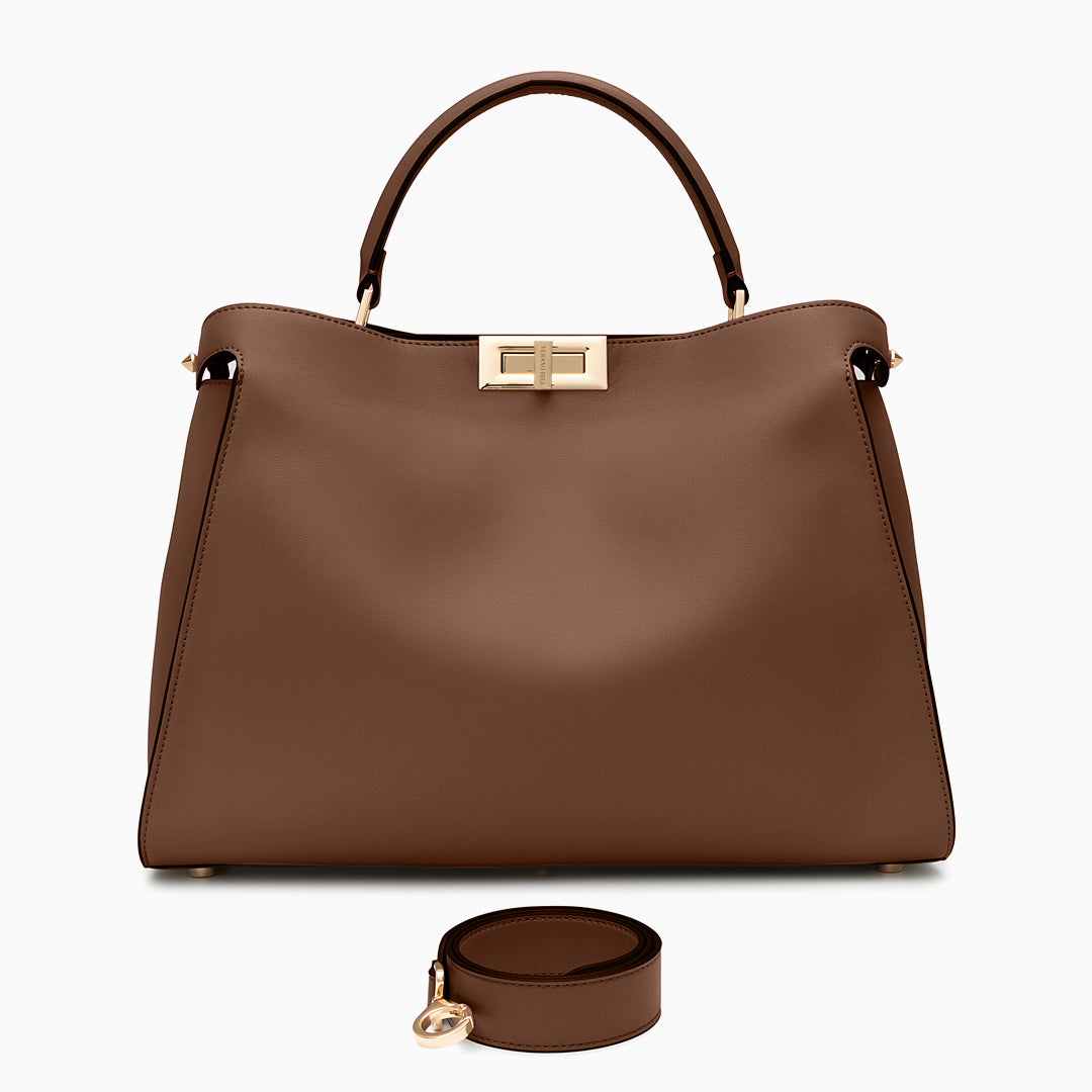 Brown handbag with a matching round pouch on a white background
