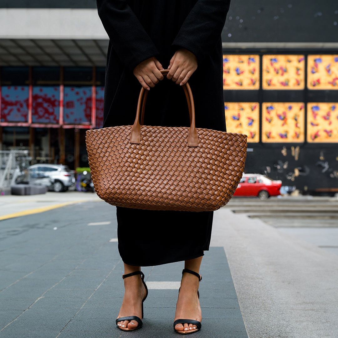 Elegant artisan woven tote bag displayed in various colors, showcasing its spacious and lightweight design. 6