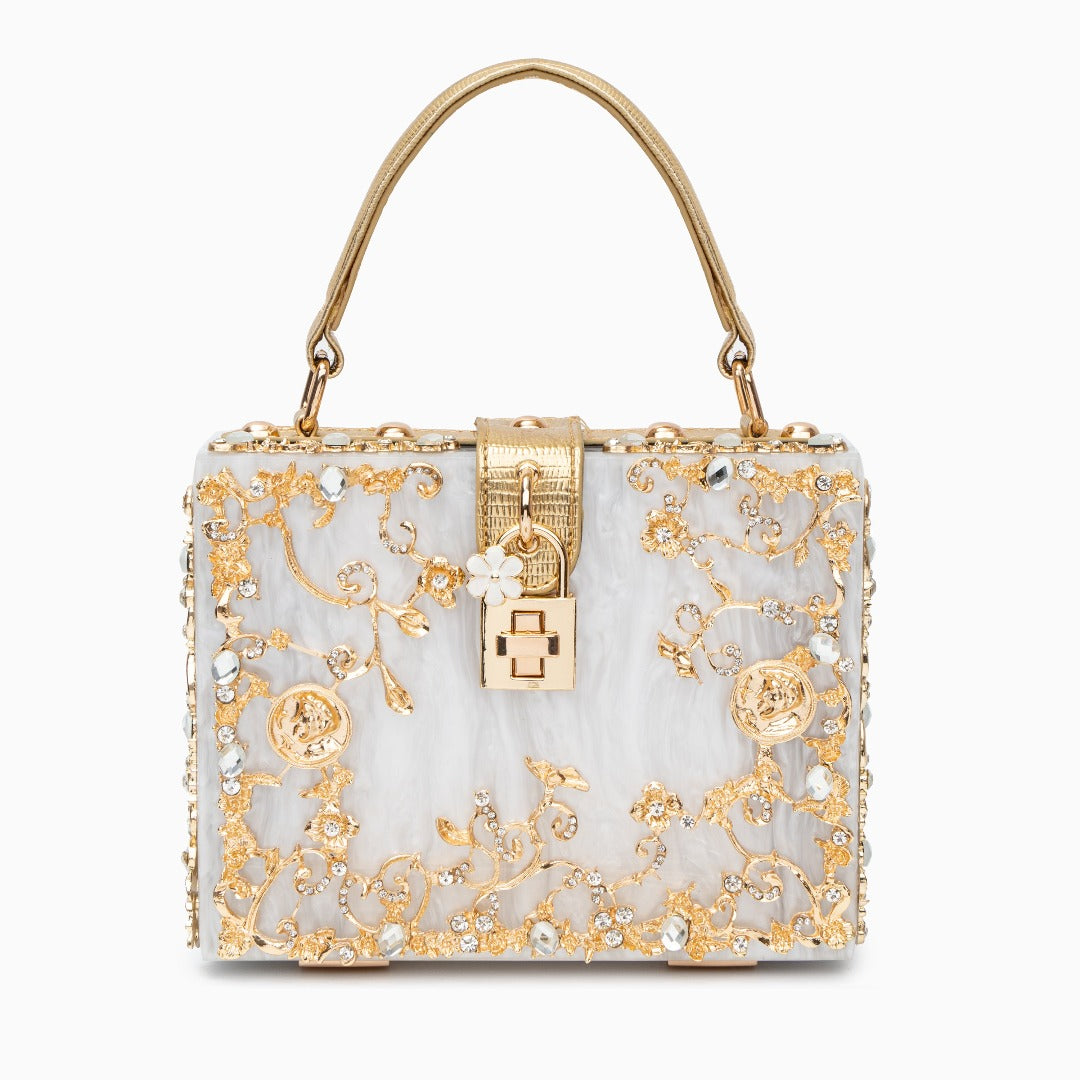Elegant floral acrylic box handbag with gold accents, featuring a stylish design and vegan-friendly materials on a white background