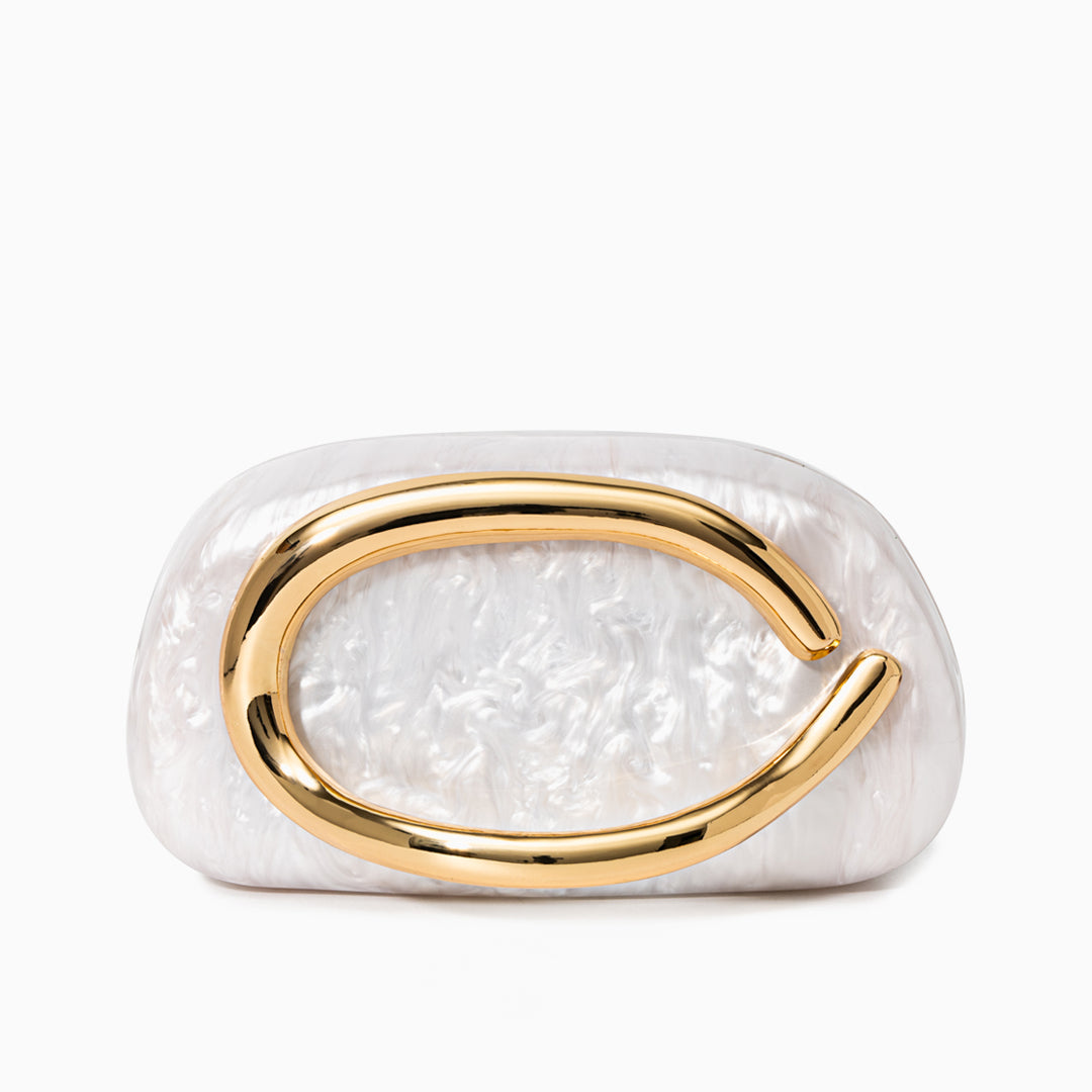 Sculptural gold clutch bag with a pearlescent acrylic finish, featuring an elegant design on a white background