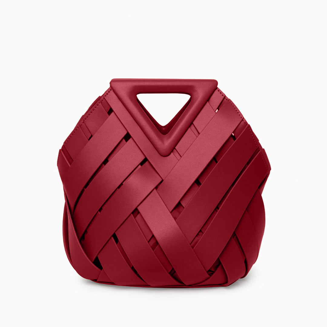 A stylish woven handbag featuring an inverted triangle handle, showcasing an elegant fabric design. 13
