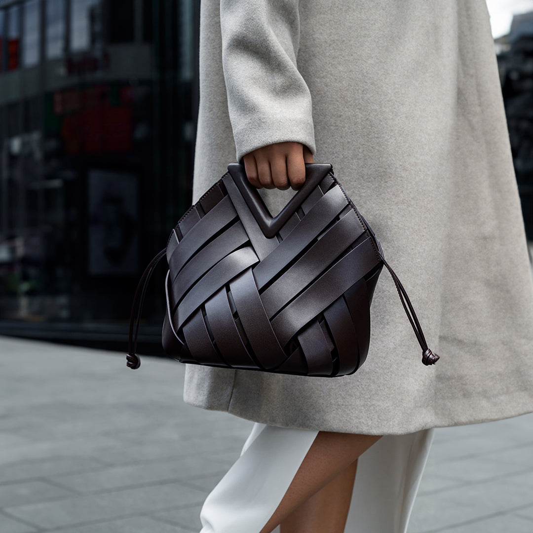 Sophia Woven Handbag featuring an inverted triangle handle with an elegant fabric design. 2