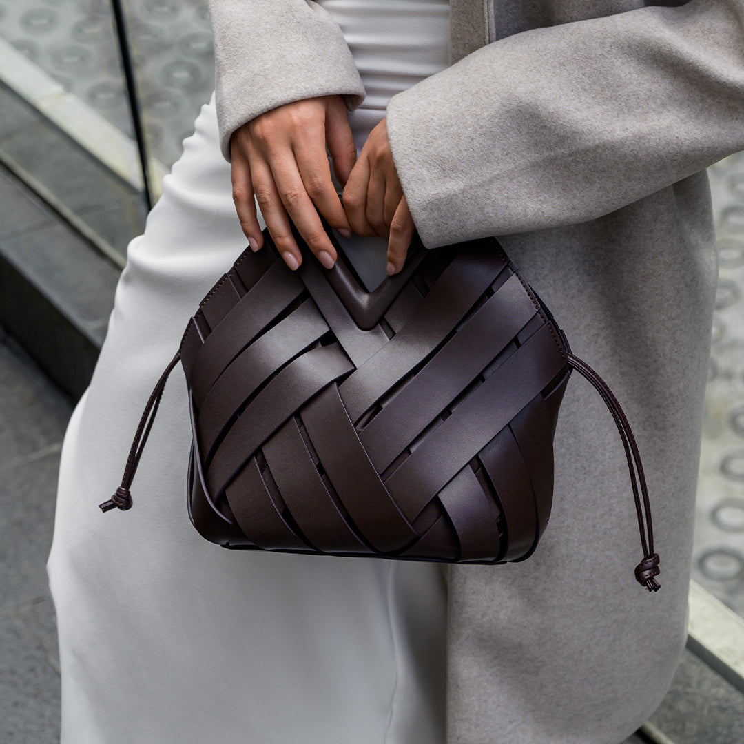 Sophia Woven Handbag featuring an inverted triangle handle and an elegant fabric design. 5