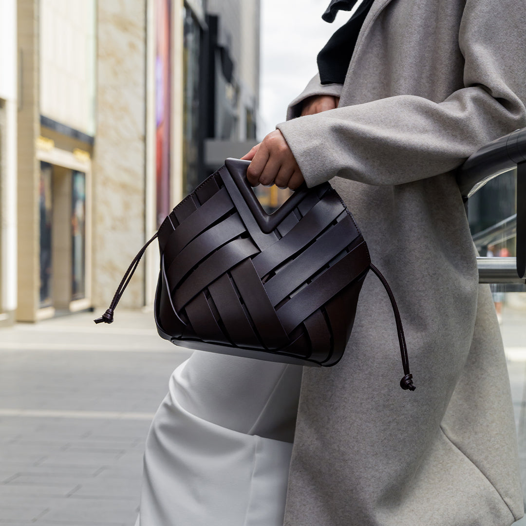 Sophia Woven Handbag featuring an inverted triangle handle and an elegant fabric design. 7