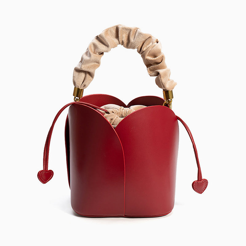 Charming Lily Bucket Handbag in Burgundy featuring a heart-shaped closure. 0