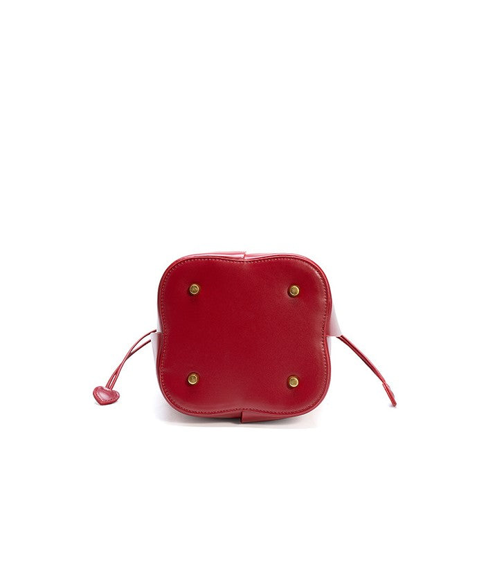 Charming Lily Bucket Handbag in Burgundy featuring a heart-shaped closure. 5