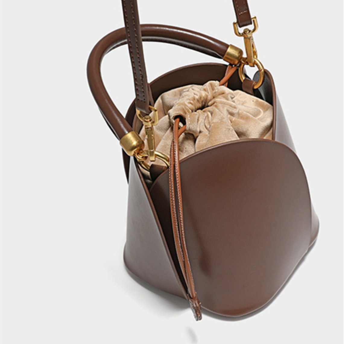 Charming Lily Bucket Handbag in Burgundy featuring a heart-shaped closure. 8