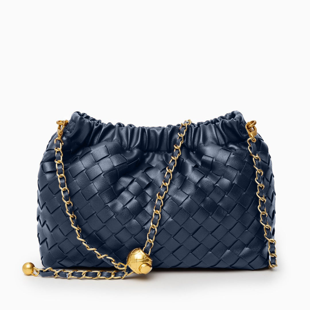 Navy blue woven handbag with a gold chain on a white background