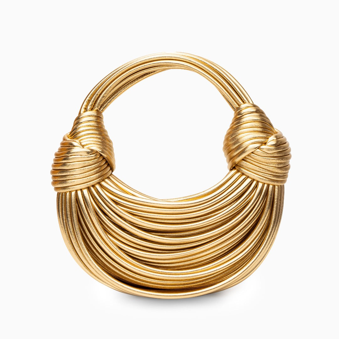 Gold handbag on white background