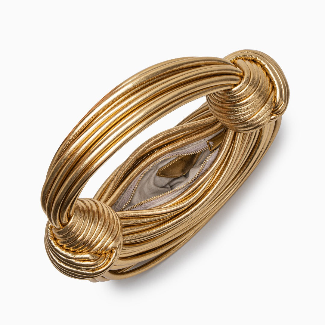 Gold handbag on white background