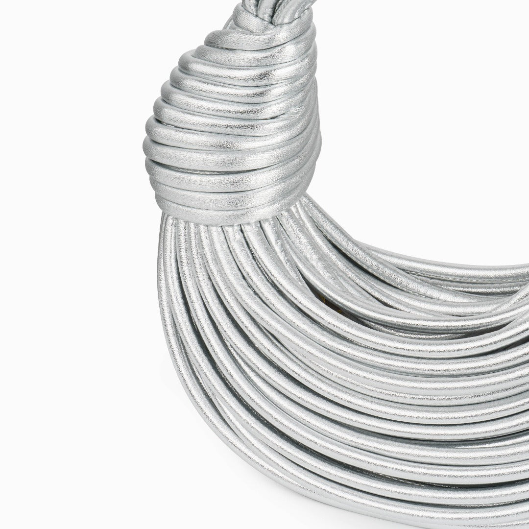 Close-up of a silver handbag on a white background