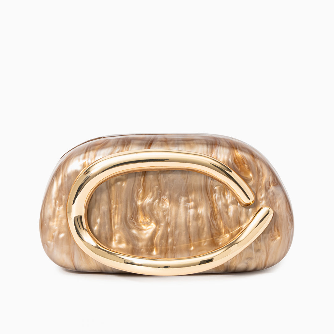 A sculptural gold clutch bag with a pearlescent acrylic finish, designed as an elegant evening purse. 