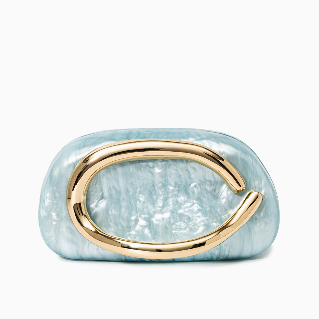 Sculptural gold clutch bag with a pearlescent acrylic finish, designed as an elegant evening purse.