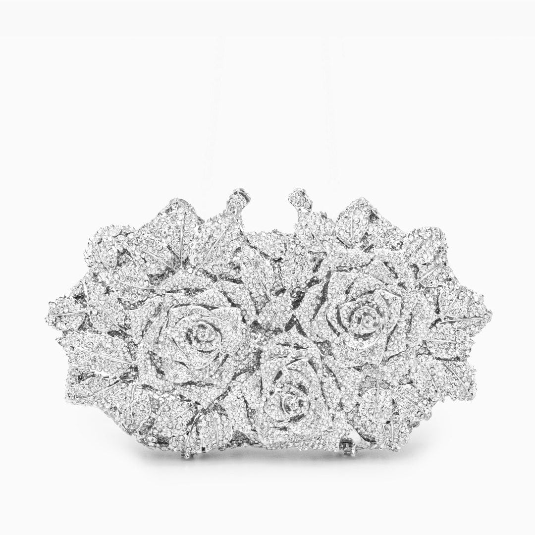 Diamond-encrusted floral brooch on a white background