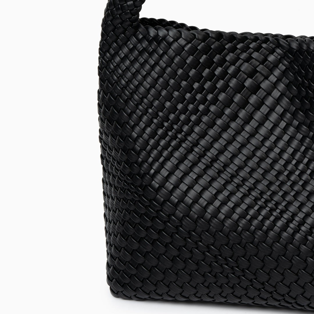 A stylish black vegan leather shoulder bag with a spacious interior, featuring elegant design elements. 1
