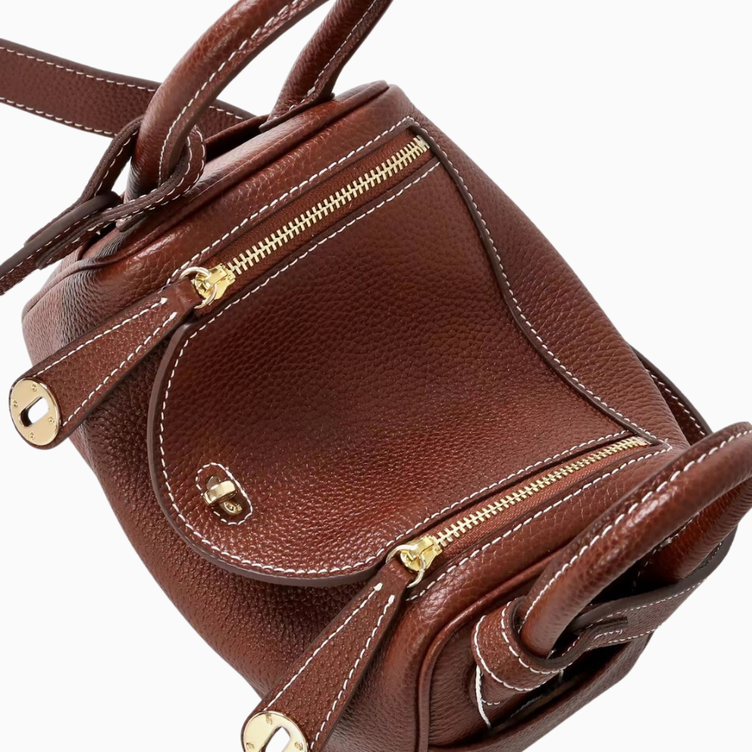 Sophia Luxe Mini Shoulder Bag in black genuine leather with a curved flap design. 4