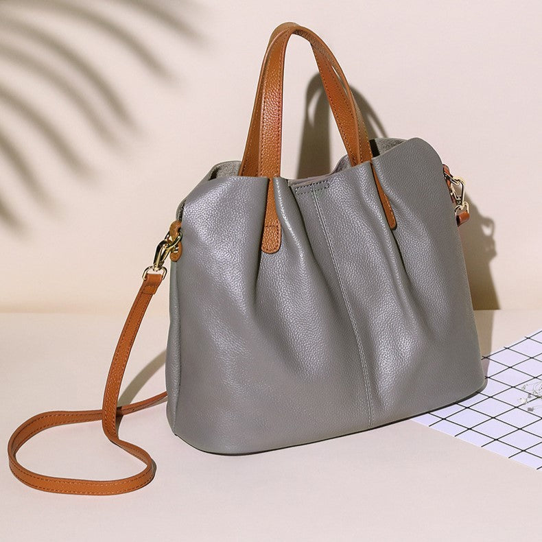 A stylish multi-colour leather tote bag with versatile carry options. 6